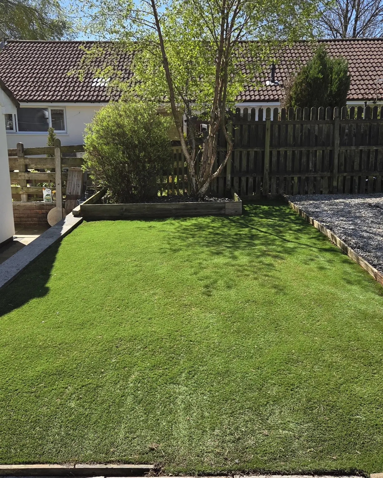 Clean usable lawn after garden clearance and restoration
